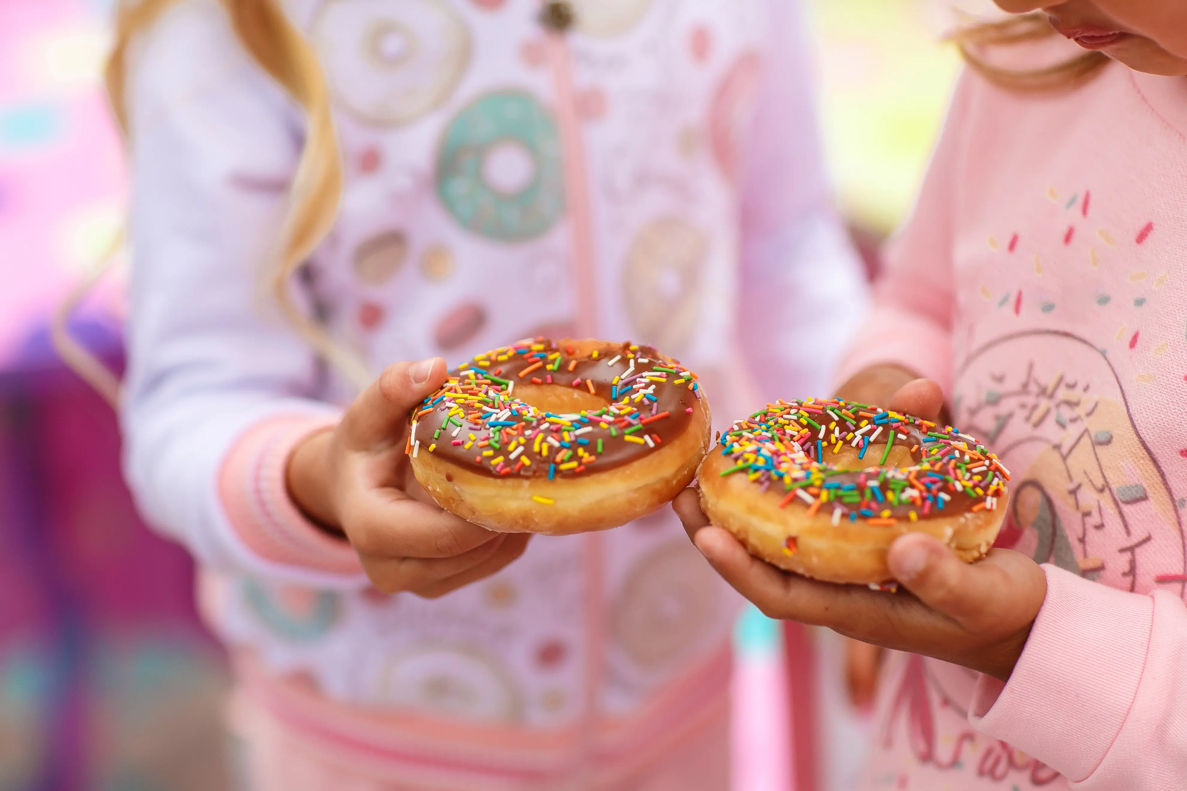 Friends sharing donuts